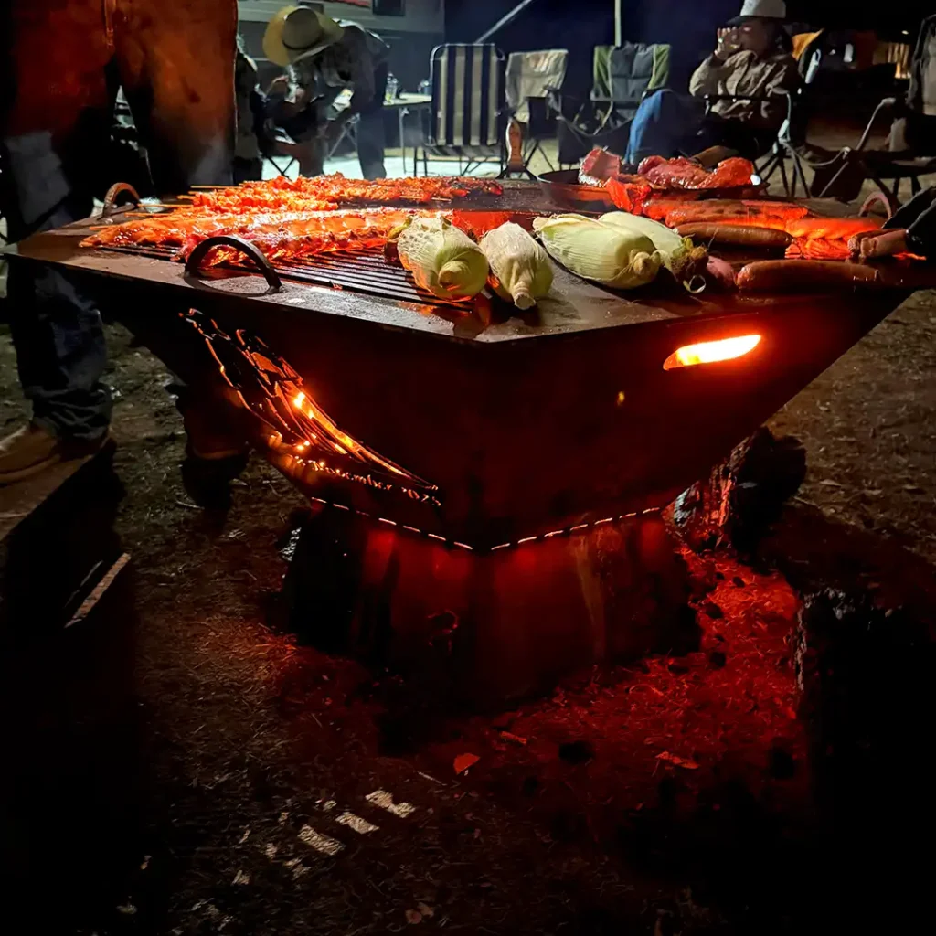 cooking on a custom fire pit grill tamworth nsw